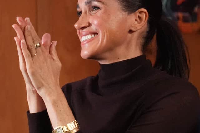 Meghan accessorised with Diana’s Cartier watch and an Oura ring (Joe Giddens/PA)