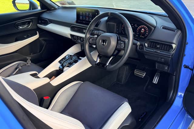Honda Prelude's driver's side interior.