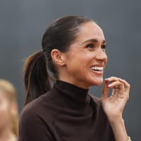 Meghan returns to public engagements in all-British designers – and a bejewelled fitness tracker