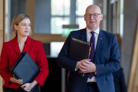 Jenny GIlruth and John Swinney in a Holyrood corridor
