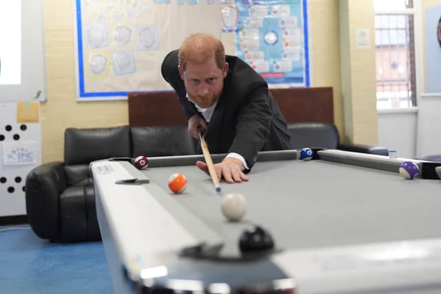 Harry playing pool (Joe Giddens/PA)