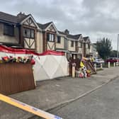 Floral tributes outside a house