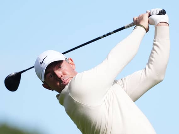 Rory McIlroy plays a tee shot