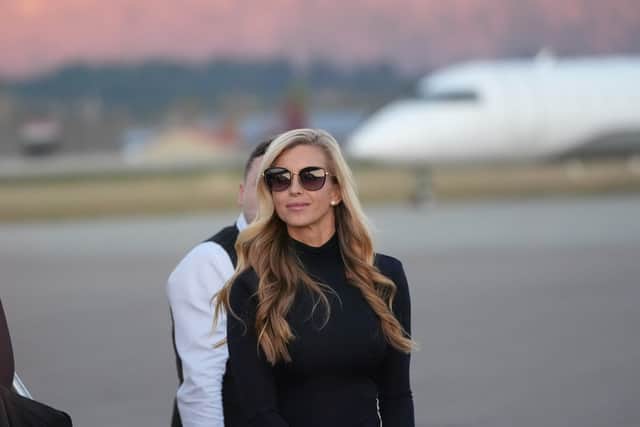 White House press secretary Katie Zacharia arrives with US President Donald Trump at Glacier Park International Airport (Alex Brandon/AP)