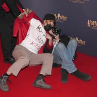 Trans rights activists rush carpet before Harry Potter And The Cursed Child show