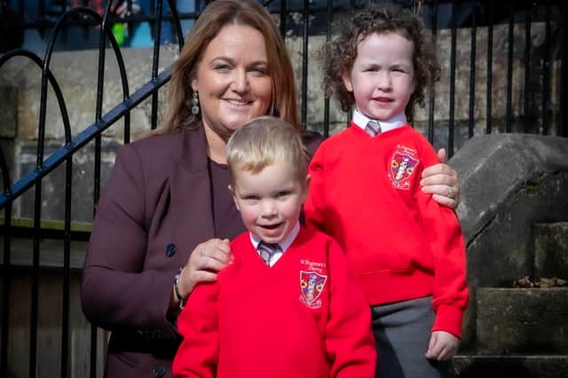 St. Eugene's new Principal, Mrs. Aine Deane pictured with two P1 pupils this week.