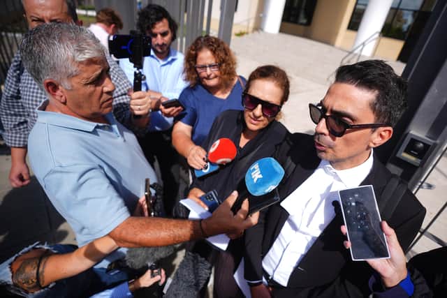 Lawyer Alexandros Alexandrou (right) speaking to journalists outside court (James Manning/PA)