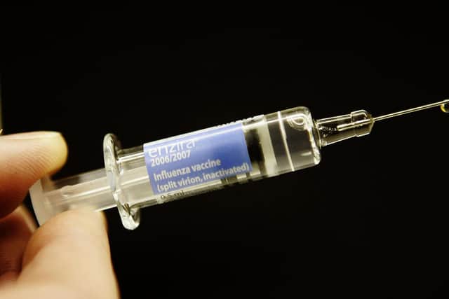 The flu vaccine protects you against the primary strains of influenza viruses expected to circulate during the winter season (Andrew Milligan/PA)