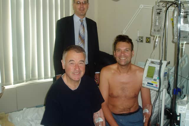 Quentin (right) with Professor Robert Hawkins (standing) and fellow patient and friend, Philip Halliwell (Collect/PA Real Life)