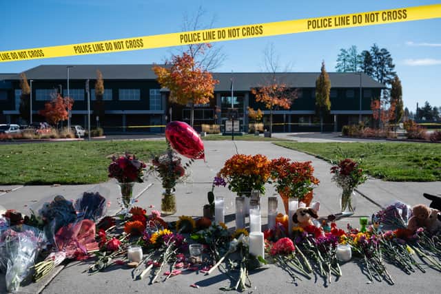 Flowers and candles outside Silver Rail Elementary in Bend (Joe Kline/AP)
