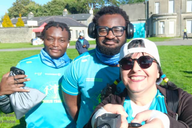 Chigozie, Mayu and Sodiq from Dundalk Sanctuary Runners enjoying the Global Solidarity Run