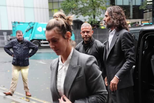 Russell Brand, accompanied by his wife Laura Gallacher, arriving at Southwark Crown Court (Jonathan Brady/PA)