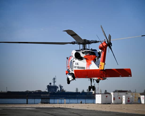 A US Coast Guard helicopter lifts off at Coast Guard Station San Diego