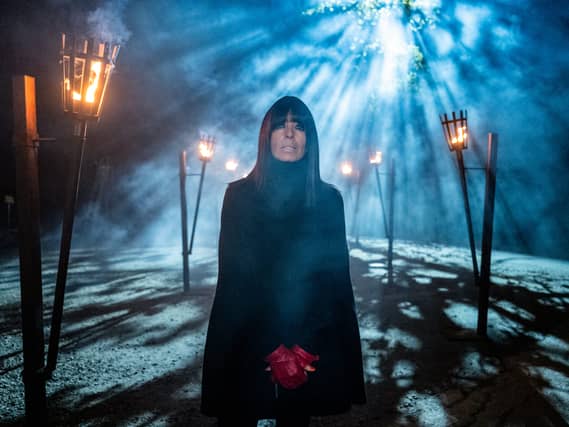 Claudia Winkleman wearing a black cloak