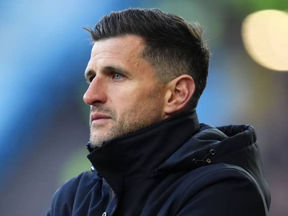 John Mousinho looks on
