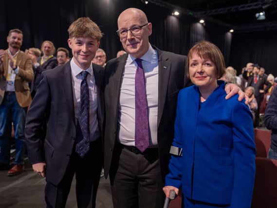 John Swinney, centre, with his son Matthew, left, and wife Elizabeth