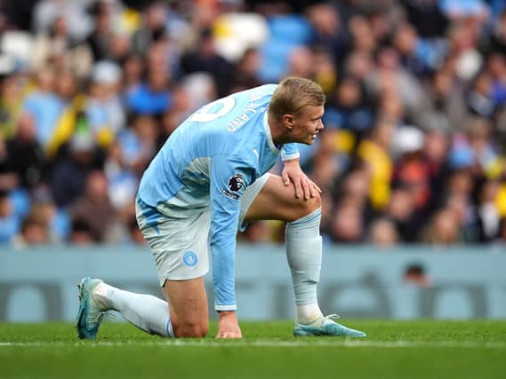 Manchester City’s Erling Haaland reacts to an injury