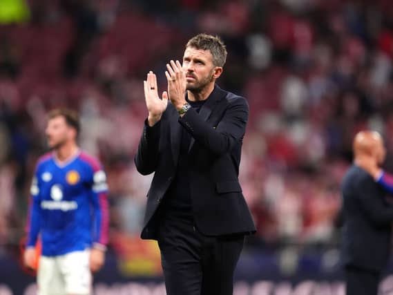 Manchester United manager Michael Carrick applauds the fans