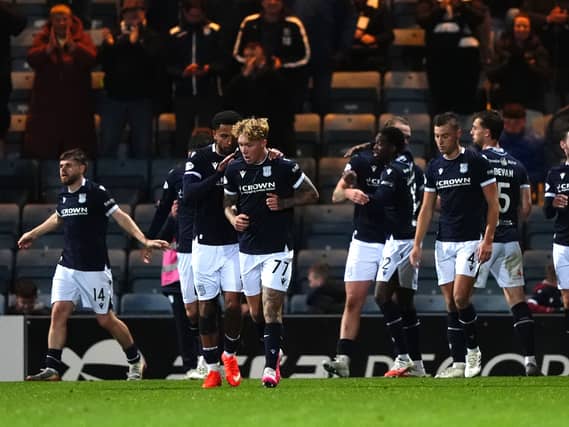 Callum Jones (second left) celebrates scoring