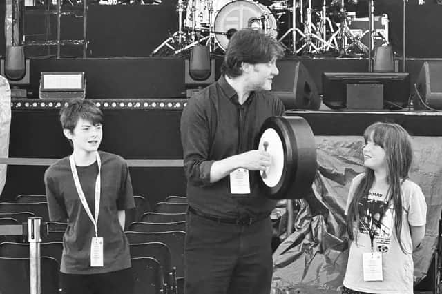 MacDara Ó Conaola with his children  Seán, 13,  and Michelle, 10 on stage at the Tocati festival