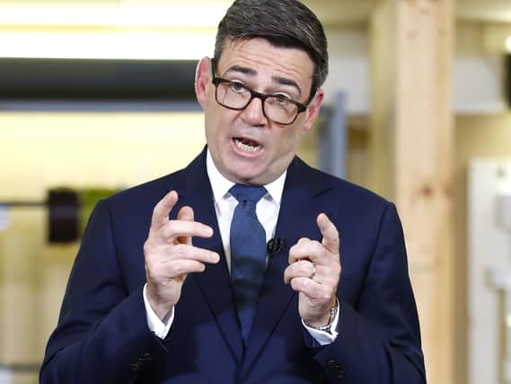 Andy Burnham gestures while speaking
