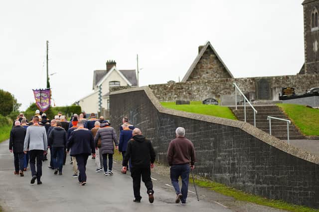 Orangemen turn away from a police barricade close to Drumcree Church (Brian Lawless/PA)