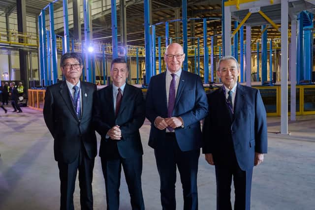 Scottish Secretary Douglas Alexander, middle left, and First Minister John Swinney, middle right, attended the opening of the factory (Sumitomo/PA)