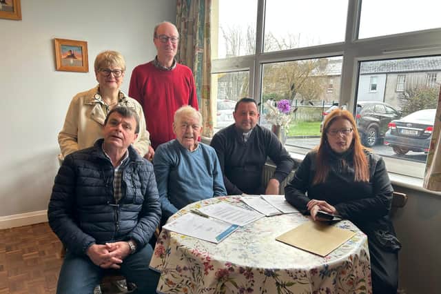 Painter Tommy Flanagan  (seated to the left at the front) with members of the St Mary's Fundraising Committee - Fe Billy Meehan, Fr Desiderio,Maria Cooke(seated and Helen Power and Michael McDermott(standing)