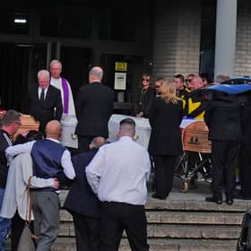 The four coffins of Philip and Kim English and their sons, Jayden and Callum, are carried into Sacred Heart Church Parish Centre in Waterford on Sunday