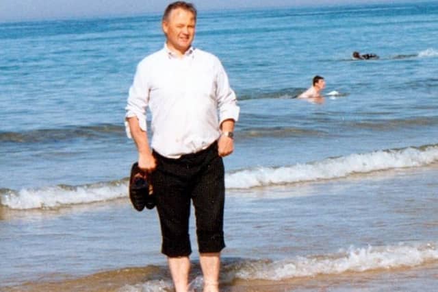 Fr Paddy O'Kane on his beloved Culdaff beach. A new book is being written about the beloved late priest, with people being asked to share their memories of him.