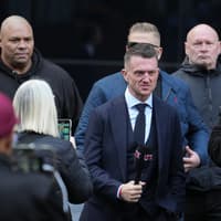 Tommy Robinson arrives at court ahead of harassment trial