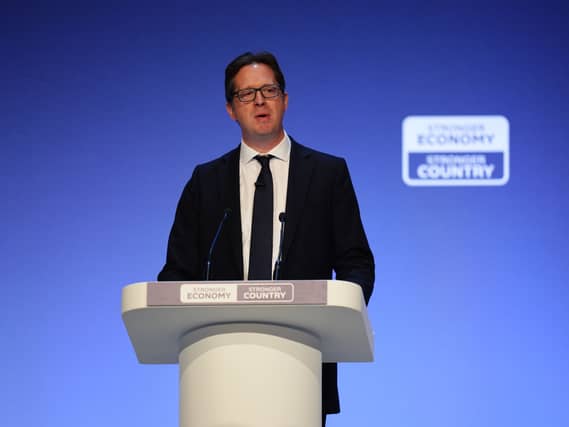 Alex Burghart speaks during the Conservative party conference at Symphony Hall, Birmingham