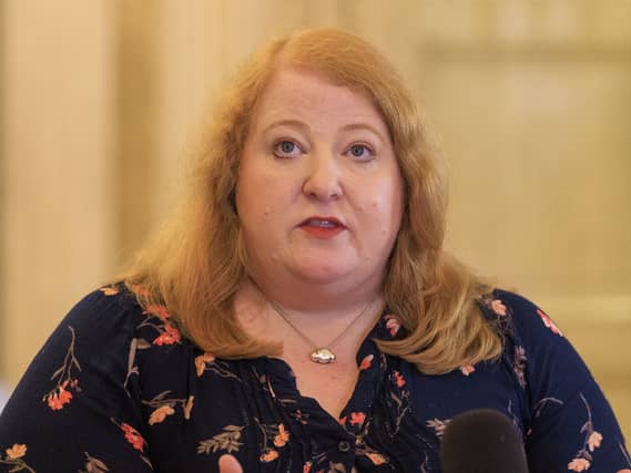 Naomi Long speaks during a press conference in Belfast