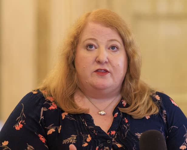 Naomi Long speaks during a press conference in Belfast