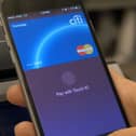 A person using their smartphone to pay