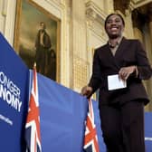 Kemi Badenoch smiles ahead of a speech