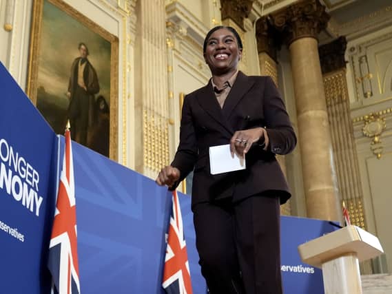 Kemi Badenoch smiles ahead of a speech