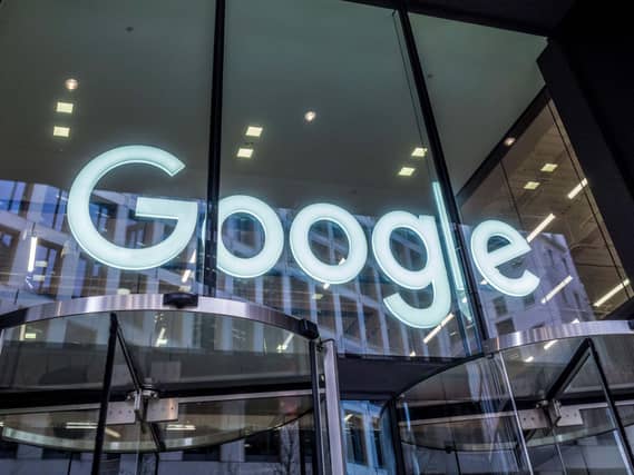 The Google logo displayed within an office building