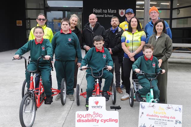 Mark Fitzimons and James O'Hanlon with Réalt na Mara pupils and teachers and members of the Louth Disability Cycle Club