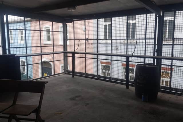 The famous 'chicken cage', where smokers will gather
