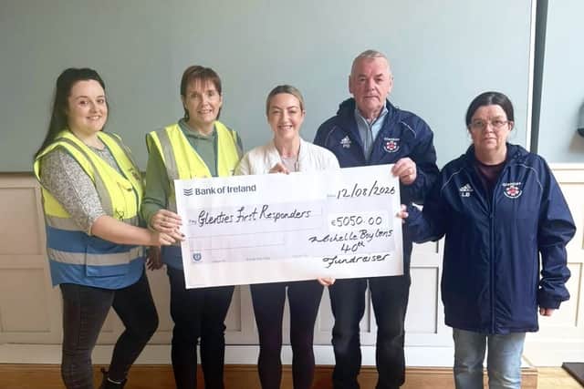Michelle presenting the cheque to Glenties Cardiac First Responders