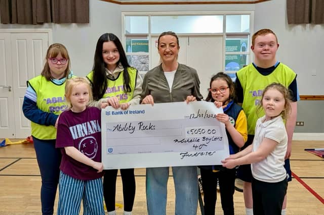Michelle presenting the cheque at Ability Rocks