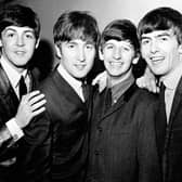 Black and white image of The Beatles in 1963