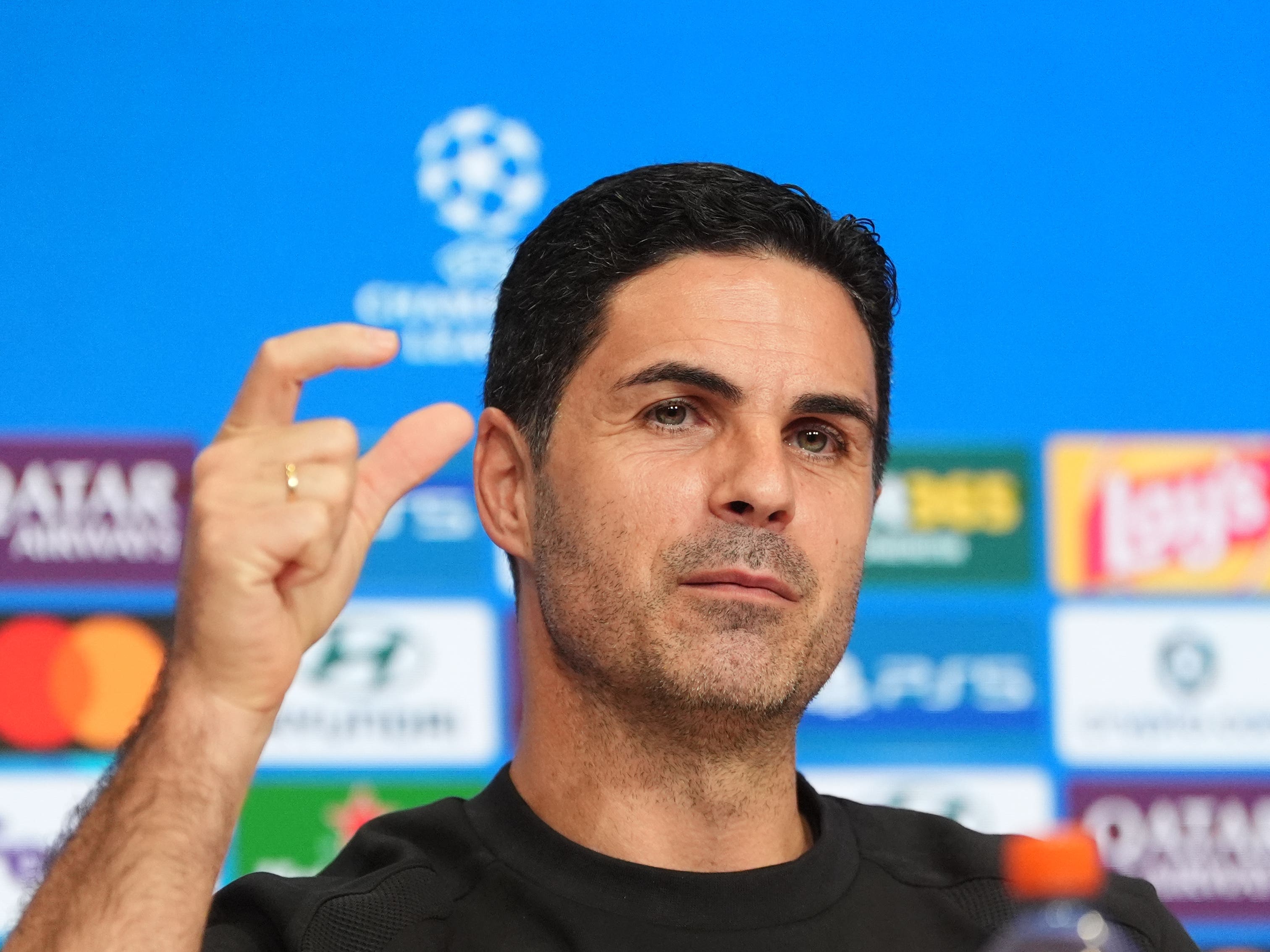 Mikel Arteta holds his thumb and forefinger a short distance apart during his pre-match press conference