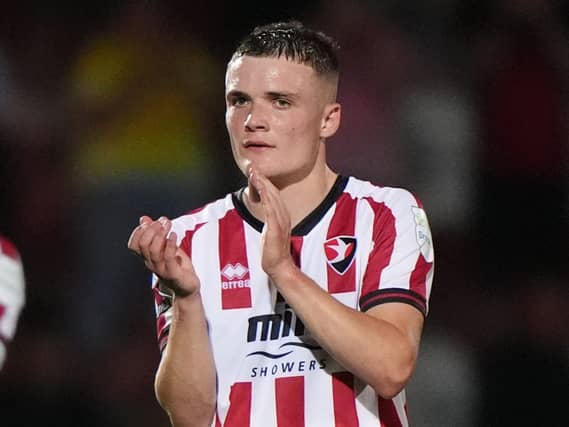 Freddie Willcox applauds the Cheltenham fans