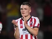 Freddie Willcox applauds the Cheltenham fans