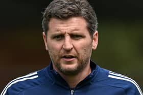 Alex Bruce looks on