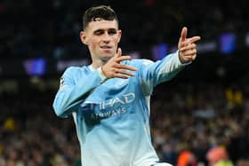Manchester City’s Phil Foden celebrates scoring a hat-trick