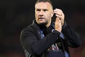 Manager Ian Evatt applauds
