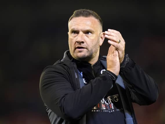 Manager Ian Evatt applauds